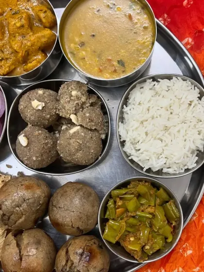 Another perspective of the wholesome Rajasthani thali, showing the vibrant colors and rich preparations.