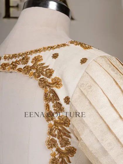 This video showcases an ivory-toned blouse with pleated puff sleeves and gold embroidery. It highlights the intricate handwork and traditional materials that go into every piece I create for my brides.