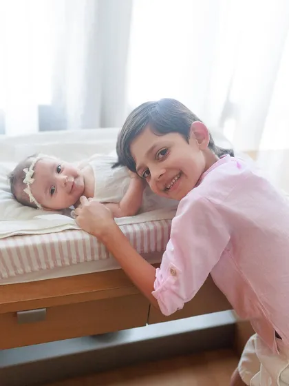The beginning of a lifelong friendship. Big brother Miguel is all smiles next to his new baby sister, Misha, during their indoor lifestyle session.
