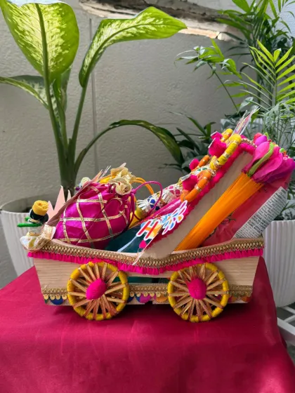A side view of the decorated cart used for our premium Holi hamper. We pay attention to every detail to make our hampers look extra special.