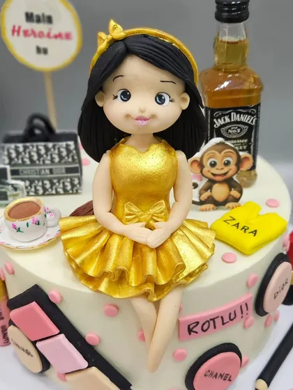 "Main apni favourite hoon!" This cake is a celebration of all the things she loves, from makeup and designer brands to a cup of coffee and a miniature Jack Daniels bottle.