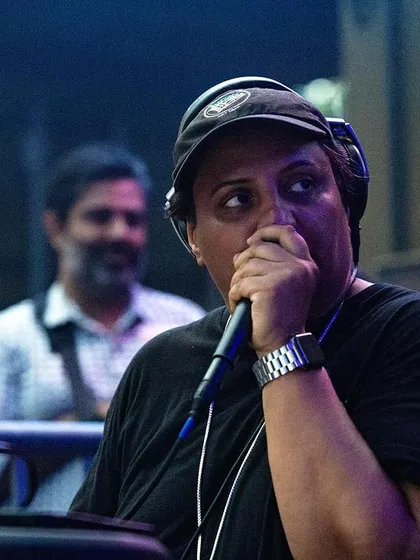 A candid shot of me on the mic during a set. I'm always checking in with the crowd, feeling their energy, and responding in the mix.