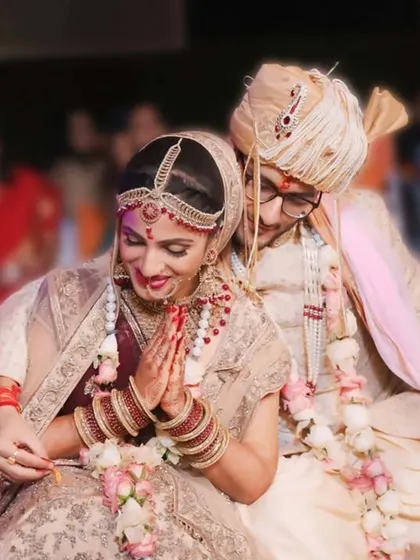 Capturing the beauty of a bride on her journey, with her groom by her side. A sweet, candid moment from their wedding ceremony.