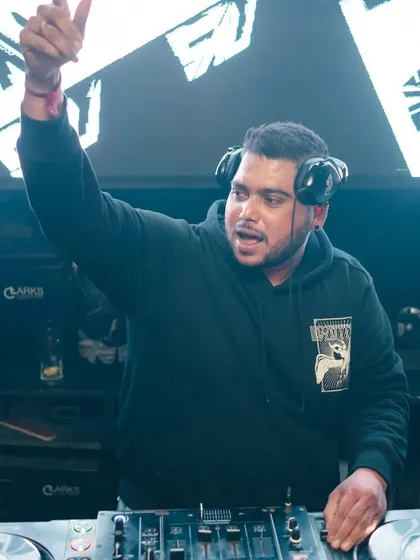 Pointing to the sky as the energy peaks. This is me signaling that we're taking the party to the next level.
