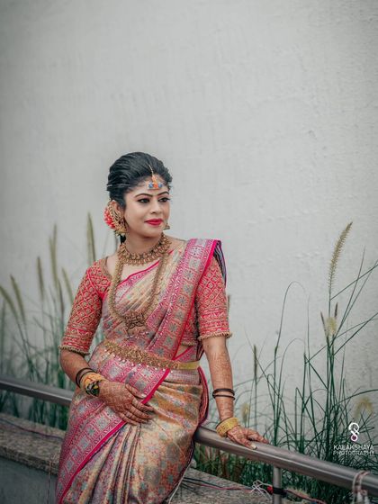 A classic bridal portrait, with the bride looking elegant against a simple backdrop.