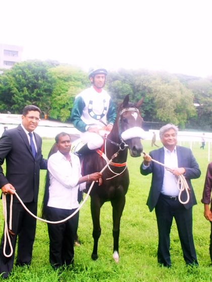 Ziva, winner of The International Labour Day Trophy, with jockey P. Trevor.