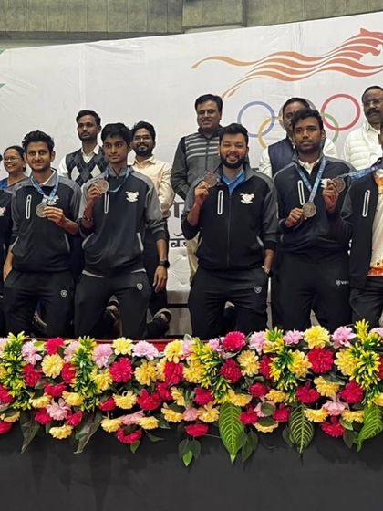 The team on the podium during the medal ceremony at the Maharashtra Olympic Games. These are the moments of pride that fuel our passion for coaching.