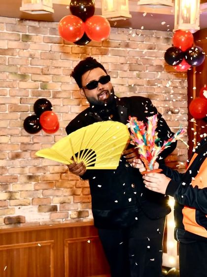 A colorful flower production trick with a young assistant. The vibrant props and exciting reveals are perfect for keeping children entertained.