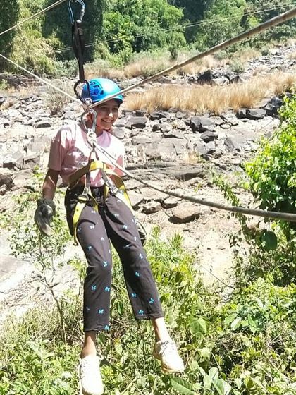 Another happy camper confidently makes her way across the rope bridge.