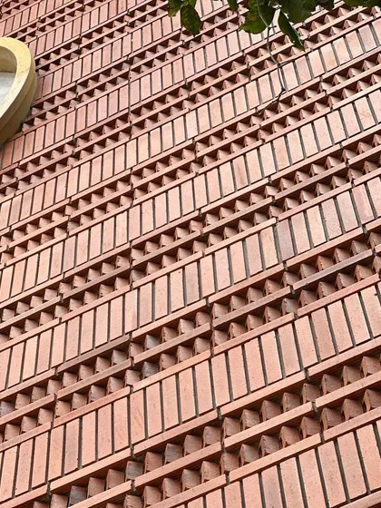 Close-up shots of the patterned brick facade. This level of detail is a hallmark of our work, showcasing the skill of our masons and our commitment to creating tactile, handcrafted building surfaces.