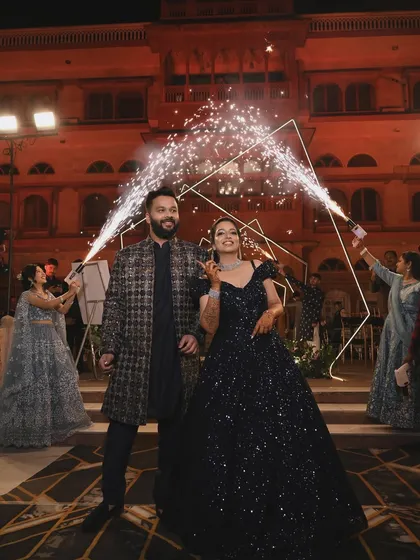 A sparkling entry for a glamorous couple. I used cold pyro fountains to frame their entrance, making them shine against the backdrop of a royal palace setting for their sangeet night.