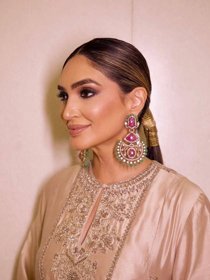 A side profile showing the sleek hairstyle and the beautifully contoured features.