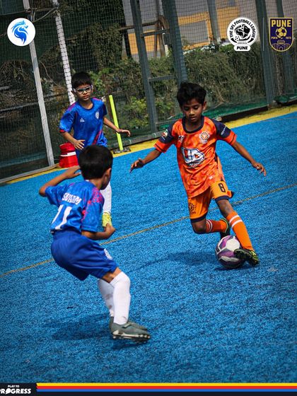 Three players converge on the ball in a tight space. Decision making in these moments is a critical skill.