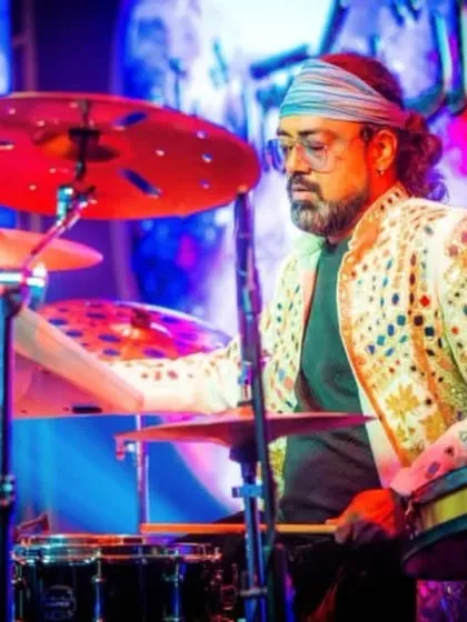 Our drummer, in his element, with a beautifully designed jacket that matches the stage's flair.