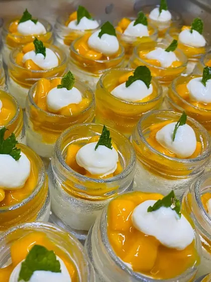 The colors of summer in a jar. Our Mango Mousse Jars are layered with creamy mousse and fresh mango chunks, a tropical delight.
