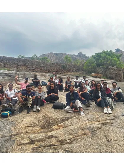 A group resting on the rocks at Huthridurga, enjoying the view and the company.