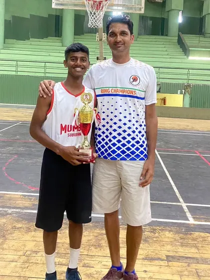 A proud moment for player Gaurav Sakpal and Coach Sylvan Desmond after a successful state championship.