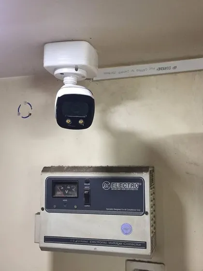 A close-up of an installed outdoor camera, showing the clean wiring and secure mounting.