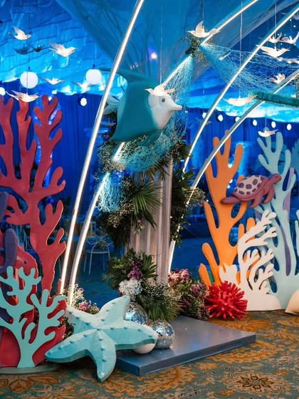 A vibrant coral reef display with custom-cut props of turtles and starfish. I use a variety of shapes and bright colors to mimic the beauty and diversity of ocean life.