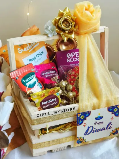 Another angle of the decorated wooden crate hamper, showing the 'Happy Diwali' tag. It's a rustic and charming option for corporate gifting.