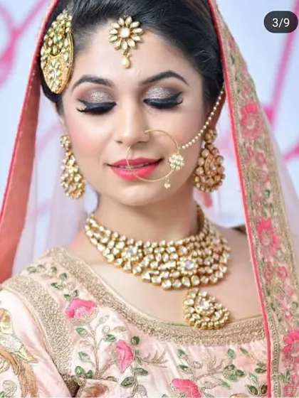 A soft and romantic bridal style. This client rented a beautiful pastel pink lehenga with bird-motif embroidery and a delicate Kundan and pearl jewellery set.