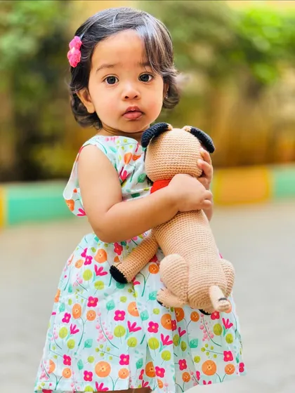 This picture just melts my heart. Seeing a happy child with one of my creations is the best reward for all my hard work. This little one is holding her Simba the pug replica, a doll made to remember her beloved pet.