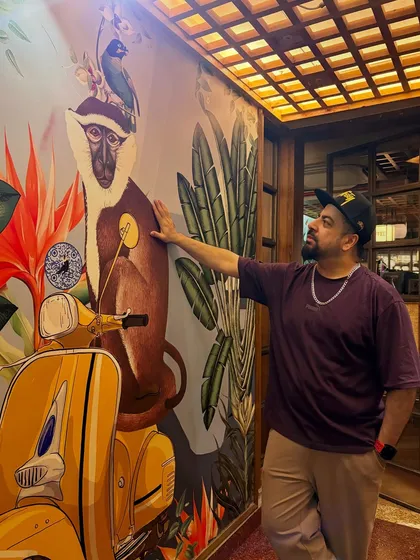 Posing with the iconic mural at Monkey Bar before my set. The vibe here is always on point.
