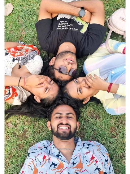 A fun, creative group photo on the grass. We always find time for some playful moments and cool pictures.