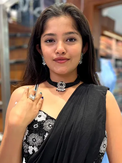 This black beaded choker with an oxidized silver pendant is a perfect Indo-Western piece for a reception look.