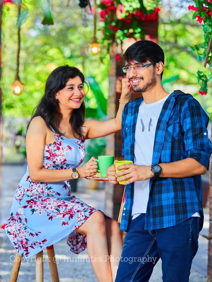 A sweet, candid moment in our cafe-style setup, perfect for a relaxed and natural-looking pre-wedding or engagement photo.