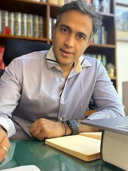 A candid moment in my office, where I spend most of my time deep in research and case preparation. My work is grounded in the belief that hard work and solid legal arguments are the only paths to justice.