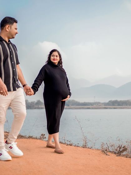 A serene lakeside walk for this expecting couple. The calm water and distant mountains provide a peaceful and majestic backdrop for their maternity session.