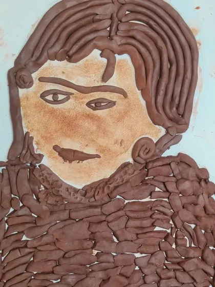 This detailed clay portrait was made during our silhouette workshop. Using coils and small pieces of clay, this student created a beautiful and expressive piece of art.