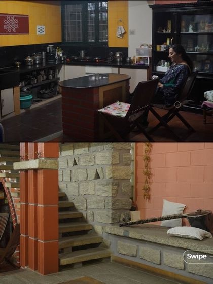 The kitchen and a built-in seating area in the V S Sreedhara Residence, showcasing the warm, earthy tones and practical design of the living spaces.