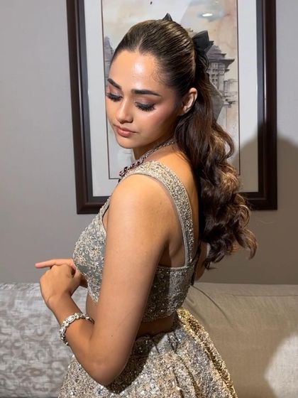 Another angle of this adorable bow ponytail. It's a simple accessory that can completely change the vibe of your hairstyle, making it perfect for a party.