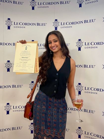 This is me at my graduation from Le Cordon Bleu in London. My formal training in culinary arts helps me curate the unique and authentic food experiences that are such an important part of the cultural immersion on my retreats.