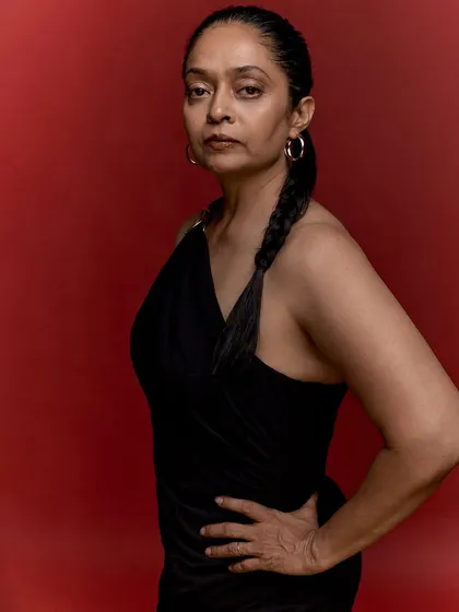 Celebrating a 50th birthday is a powerful milestone. Against a bold red backdrop, this portrait captures the confidence and grace that comes with fifty years of becoming, telling a story of self-embracement and strength.