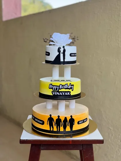 A unique three-tier cake designed to celebrate three different occasions at once: a birthday, an anniversary, and a tribute to the "Best Dad."