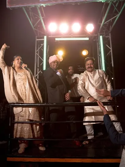 Cheering on the baraatis from the truck. My enthusiasm is a key ingredient in making the baraat a high point of the wedding.