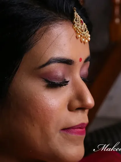 A complete look at Nirosha's engagement style. She wore a vibrant silk saree, and we created a soft glam look with a pretty pink lip and a chic updo.