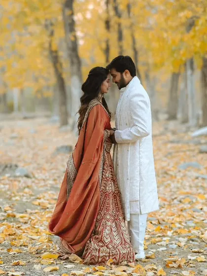 A couple shares a quiet moment in a forest of golden autumn leaves in Himachal. This image highlights my ability to use stunning natural landscapes to create epic and romantic pre-wedding portraits.