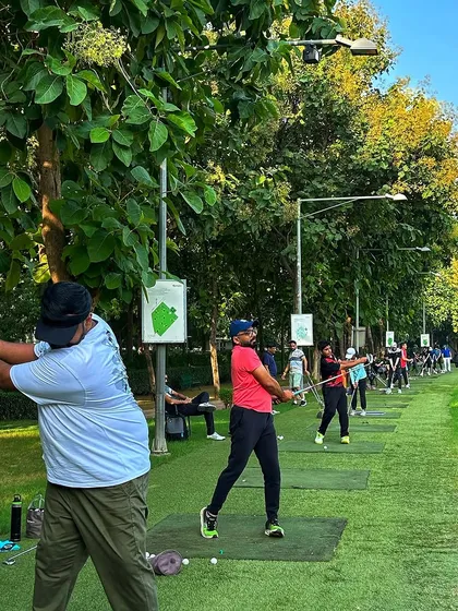 A full line of golfers, each in their own zone, working on their game. The shared energy on a Sunday is unmatched.
