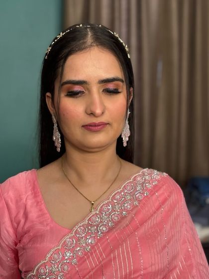 A close-up of the soft pink eye makeup, which is perfect for a daytime event or for someone who prefers a more subtle look.