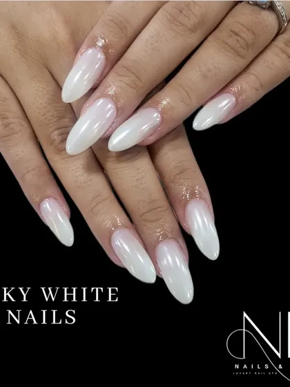 This is our popular milky white finish. It provides a clean, semi-translucent look that is incredibly chic and versatile, shown here on long almond-shaped nails.