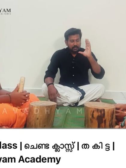 Our guru demonstrates the 'tha ki tta' rhythm pattern to young students. This direct, hands-on instruction is a hallmark of the Gurukulam system.