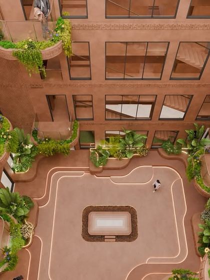 Another high-angle view of the courtyard, showcasing the organic flow of the planters and pathways. The design blurs the line between built and natural environments.