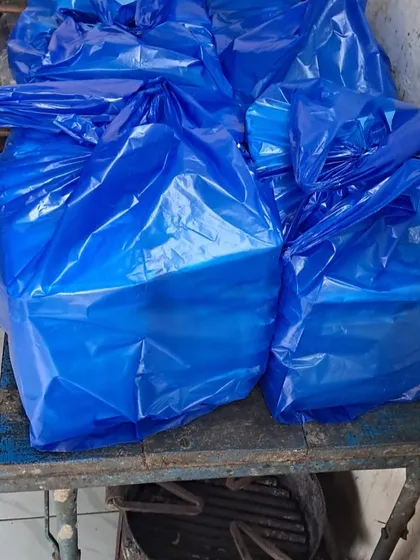 The final step: packed meal containers are organized into large bags for clean and efficient transport and delivery to the institution.