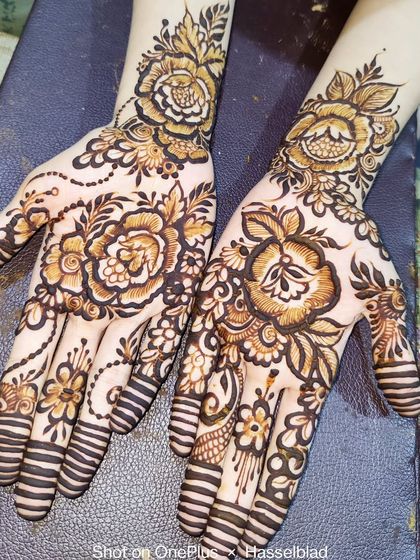 A lovely design with shaded roses on the back of the hands, perfect for a party or festive event.