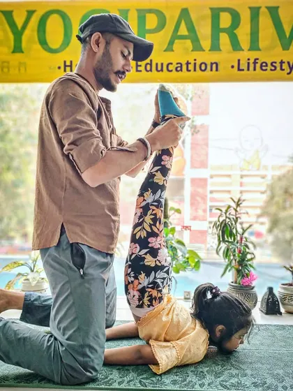 We believe in starting the journey early. In our kids' yoga batch, we help young ones build strength and flexibility with gentle, hands-on adjustments in poses like Baddha Konasana (Bound Angle Pose).