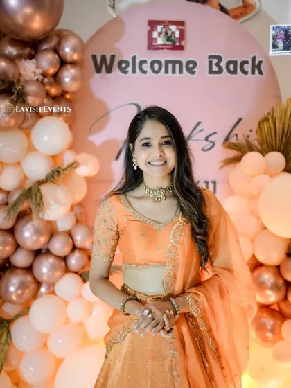 More moments from Mokshitha Pai's welcome home celebration, showing her interacting with the personalized decor we created.
